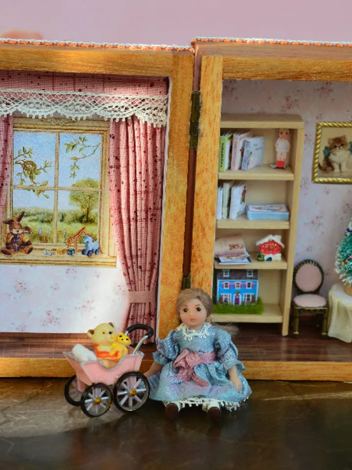 Miniature doll in 24th scale. Tiny doll with accessories in a wooden casket at a scale of 1:24.