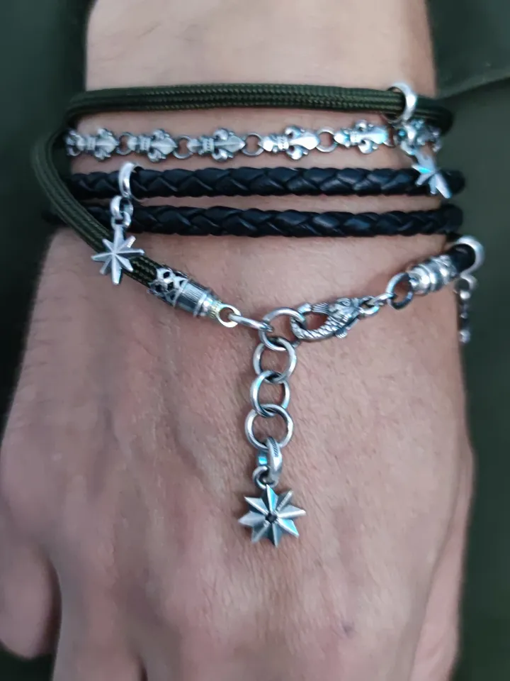 Designer multilayer bracelet with elements of chain, genuine leather and paracord