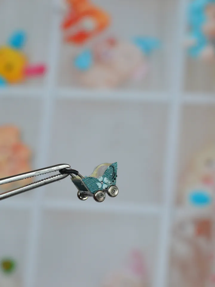 Miniature doll stroller. 1:48 scale. Dollhouse toy. Baby stroller.
