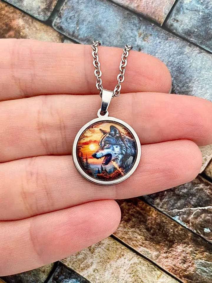 Wolf at sunset, steel pendant with glass