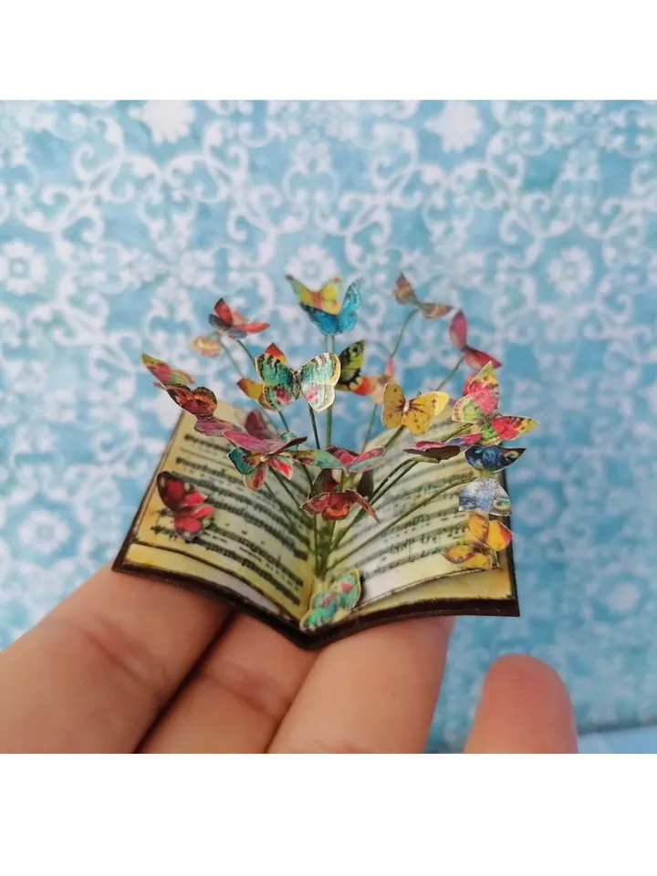 Miniature book with flying butterflies.1:12 scale.