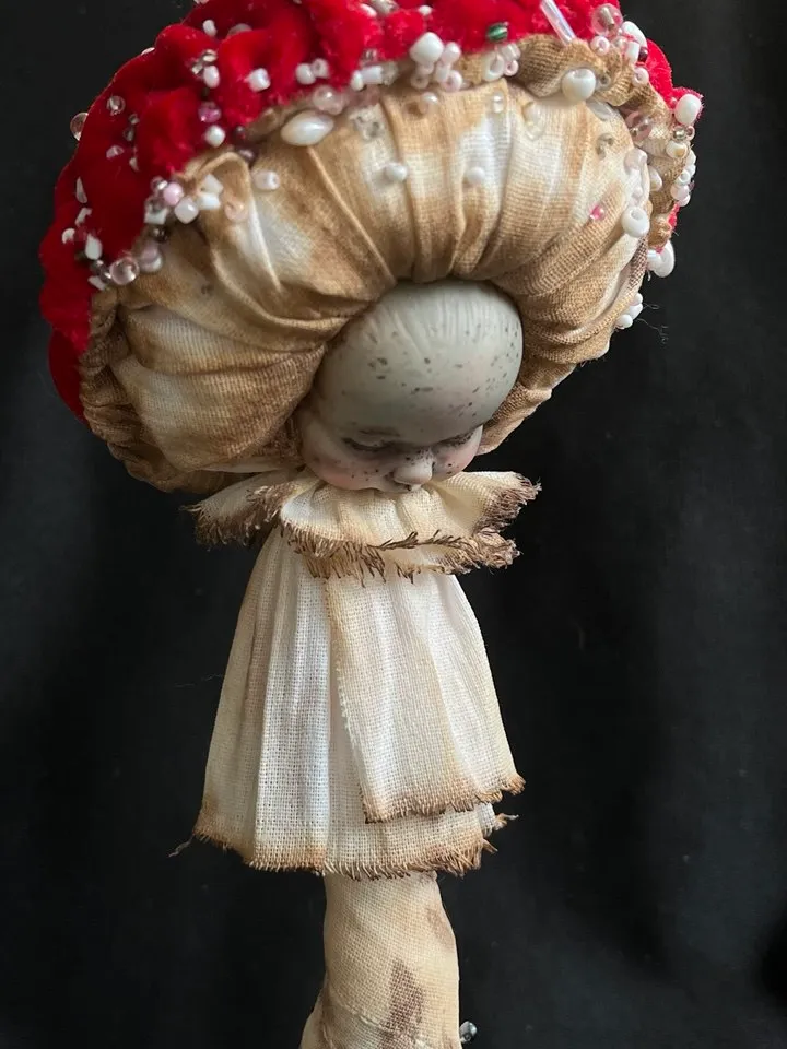 Art doll Mushroom. Unusual handmade statuette. Sleeping child-toy in the image of a fly mushroom. Mushroom is a textile sculpture. Unique statuette made of fabric and polymer clay, decorated with beads and beads. An art object for your interior and collec