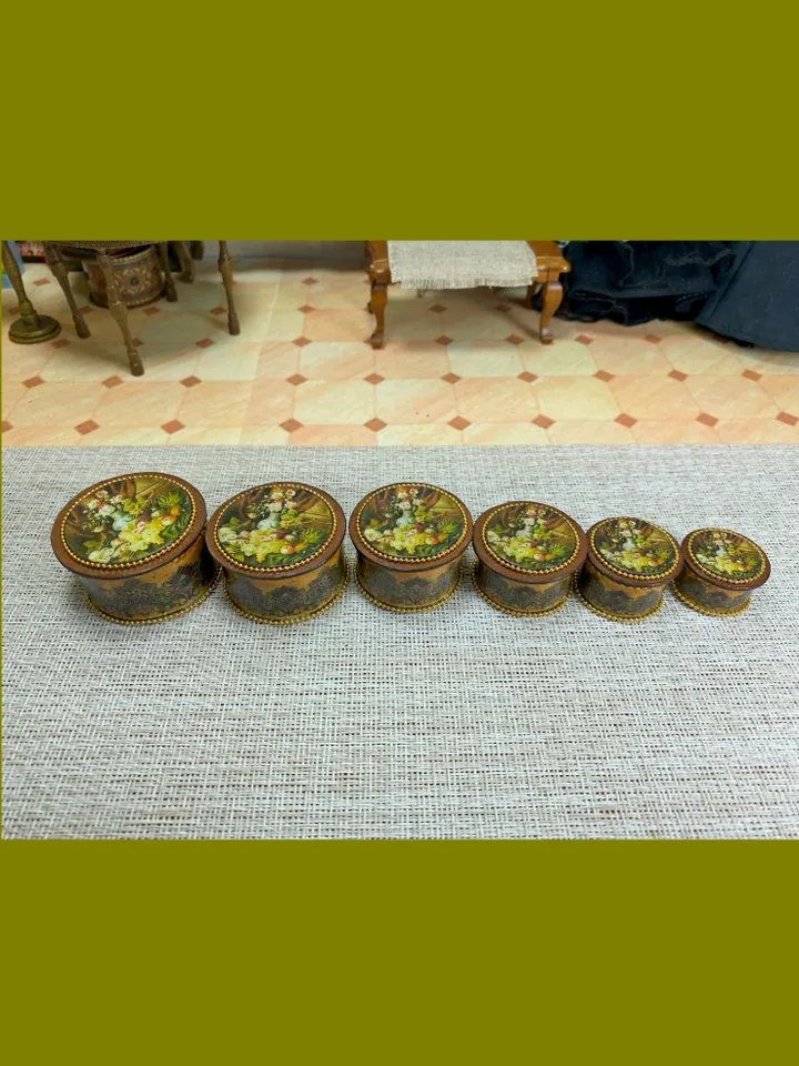 A set of handmade miniature boxes for filling the interior of a dollhouse in 1:12 scale.
