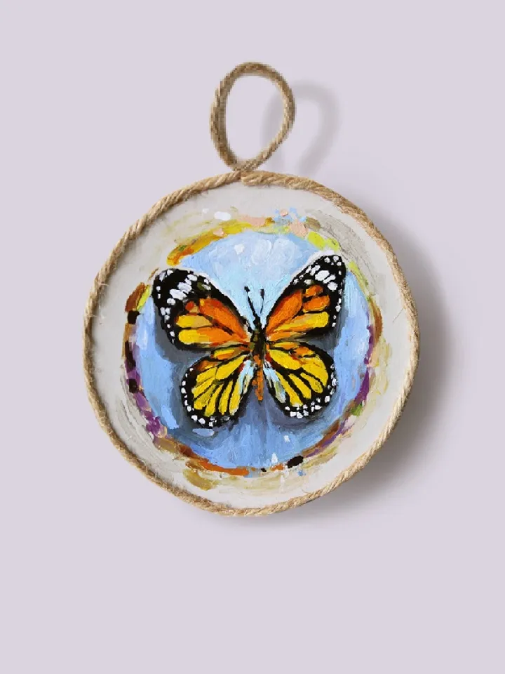 Butterfly medallions painted with oil paints on quartz vinyl, with a loop to hang. 3 pieces.