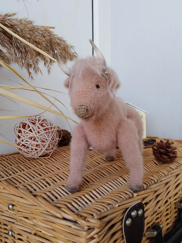 Naturalistic handcrafted bull figure with decorative elements. Stuffed cow Collectible model specimen bull toy