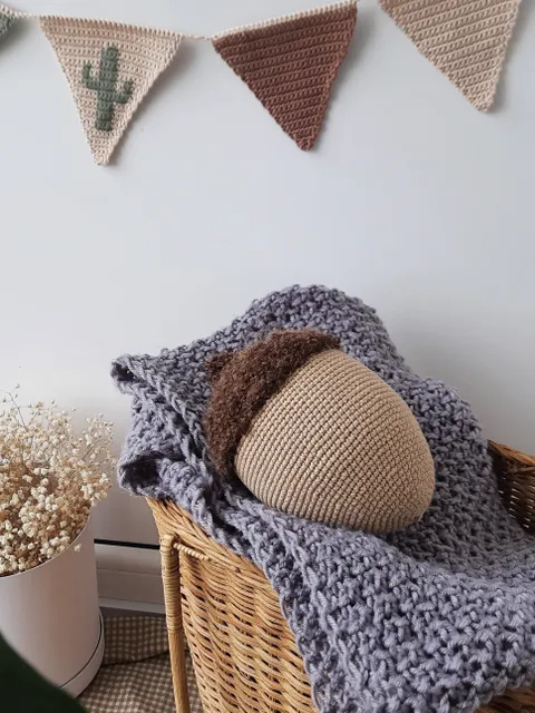 Stuffed biege acorn toy for Home decor. Acorn in Scandinavian style. Decoration of apartments and houses. Universal gift