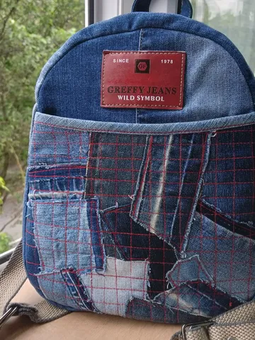 Stylish HANDMADE denim BACKPACK WITH a DEEP POCKET IN THE FRONT IN the lazy boro Patchwork STYLE and lined with red plai $88.00