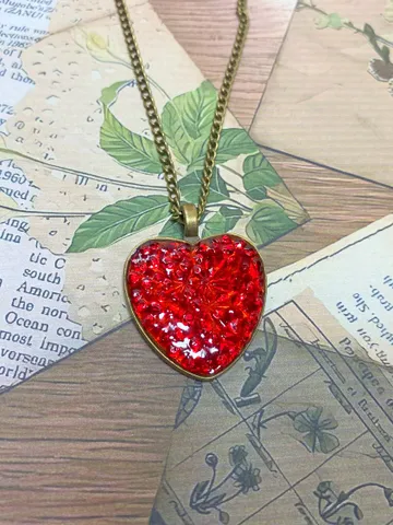Pendant on a cord. Red heart. Handmade jewelry.3D effect. $22.00