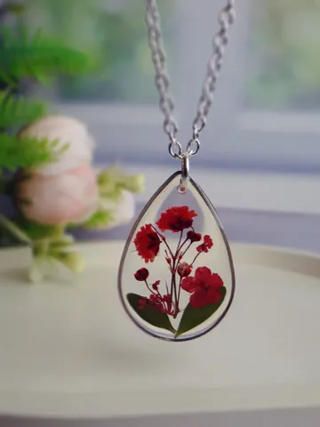 Pendant with real flowers $85.00