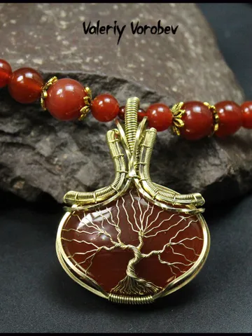 Handmade necklace with a pendant made of natural carnelian and brass wire. $85.00