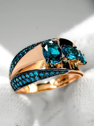 Ring Silver gold plated 925 assay value with London topaz and blue cubic zirconia $119.00