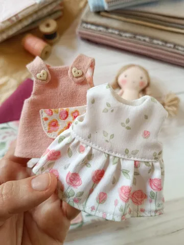 Small portable textile dollhouse with doll and set of clothes $99.00