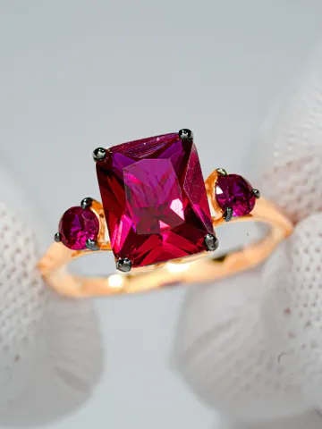 Ring made of 925 silver (585 gold coating) with corundum, ruby and pink cubic zirconia $95.00