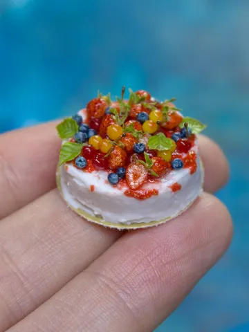 MINIATURE cake with berries on a gold cardboard stand  1 $59.00