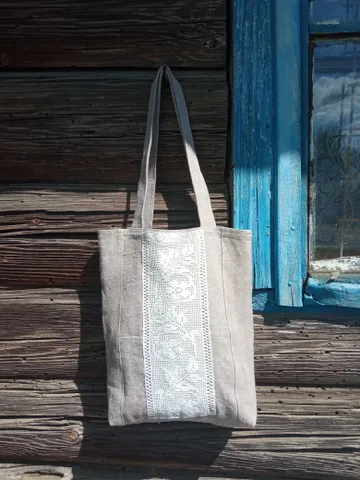 Handmade bag made of linen fabric with hand-knitted lace