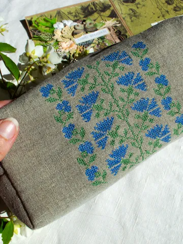 Cosmetic bag or pencil case made of linen with embroidery of a traditional folk ornament cornflower flowers