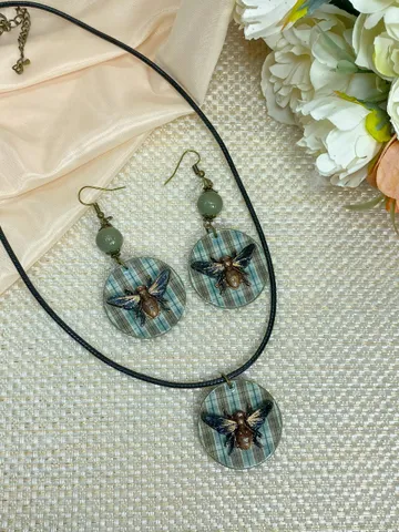 Author's set of handmade jewelry.Earrings and pendant on a cord with voluminous flies. $35.00