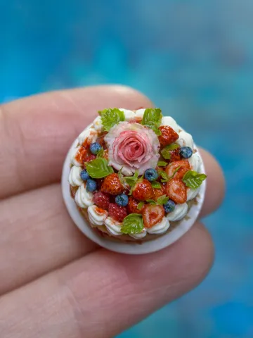 MINIATURE cake with rose and berries on a ceramic plate  2 $63.00