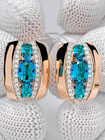 Earrings Massive earrings made of 925 silver (585 gold coating) with London topaz and white cubic zirconia $125.00