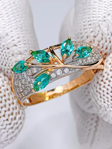 Ring made of 925 silver (585 gold coating), with paraiba and white cubic zirconia $85.00