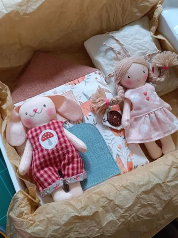 Small portable textile dollhouse with doll and set of clothes $120.00
