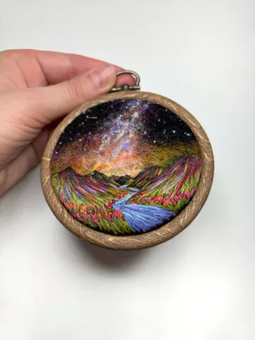 Embroidered and needle felted painting "Cosmic peaks" $280.00