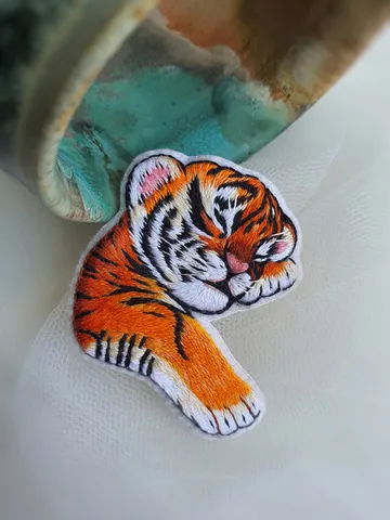 Sleeping Tiger Cub Brooch. Hand-embroidered with satin stitch
